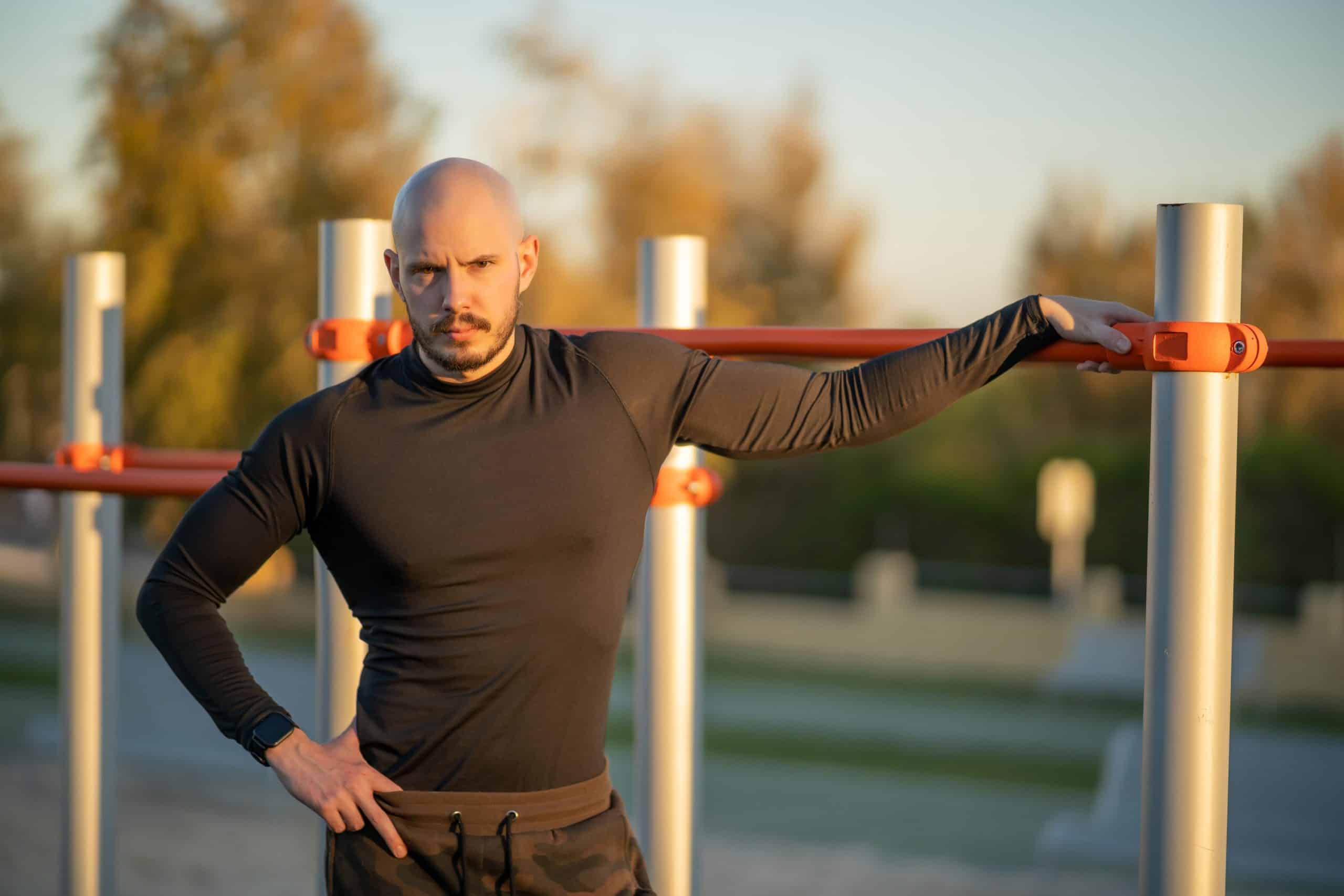 young-hispanic-man-having-rest-after-working-out-sports-ground (1) scalp micropigmentation